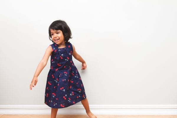 Toddler in a cherry Dress