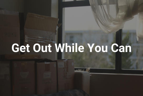 Image of boxes full of personal belongings with "Get Out While You Can" text overlayed, suggesting a person should leave a situation of emotional abuse.